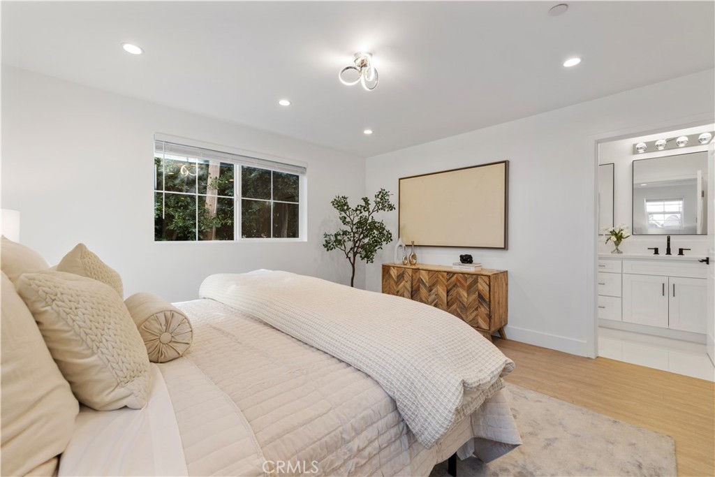 5248 Segals Way Sherman Oaks, CA 91411 - Photo 18 of 37 a bedroom with a large bed and a window