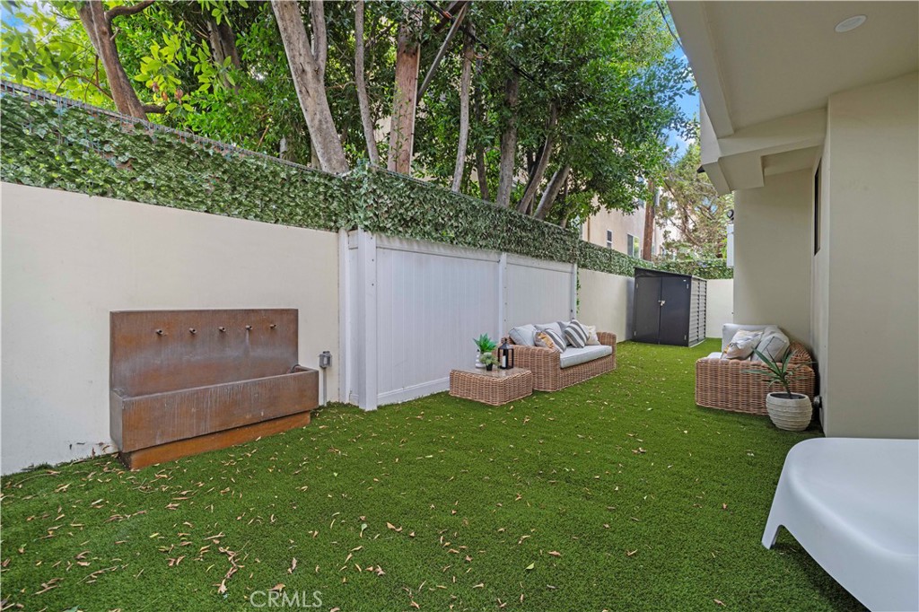 5248 Segals Way Sherman Oaks, CA 91411 - Photo 33 of 37 a front view of a house with garden and trees
