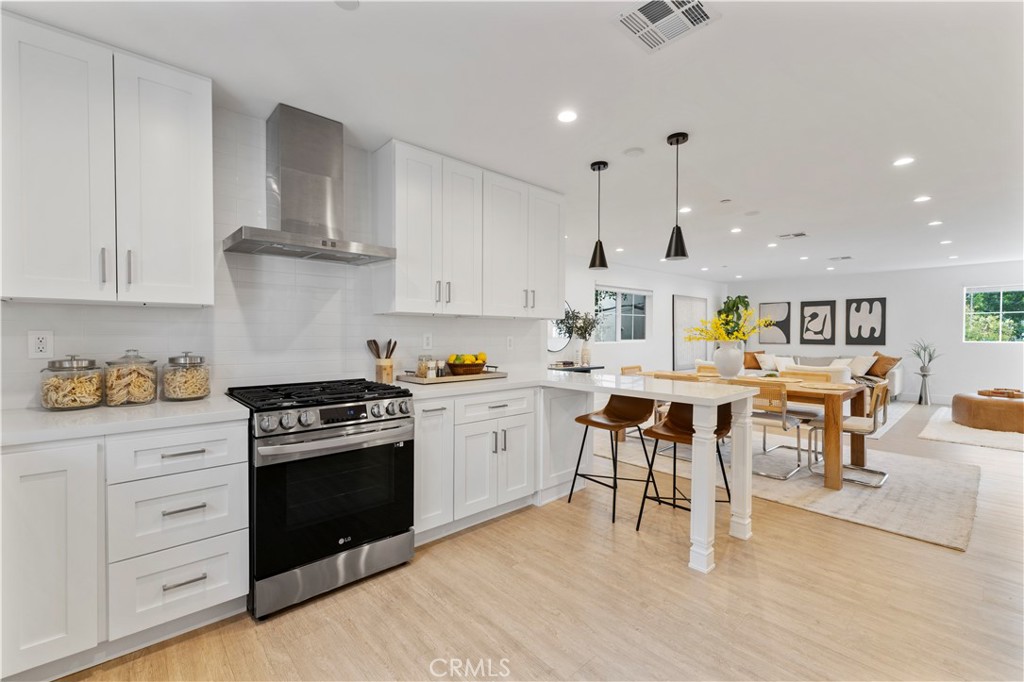 5248 Segals Way Sherman Oaks, CA 91411 - Photo 10 of 37 a open kitchen with stainless steel appliances granite countertop a stove and a refrigerator