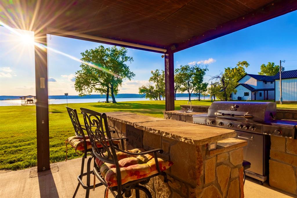 1167 Willow Road Graford, TX 76449 - Photo 9 of 33 a view of a swimming pool with a table and chairs in the patio