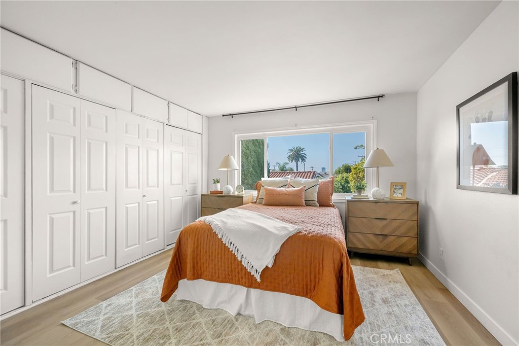 2844 East 3rd Street, Unit 210 Long Beach, CA 90814 - Photo 15 of 23 a bedroom with a bed and a couch