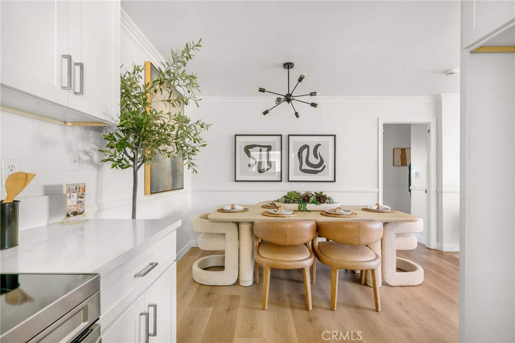 2844 East 3rd Street, Unit 210 Long Beach, CA 90814 - Photo 2 of 23 a view of a dining room with furniture and wooden floor