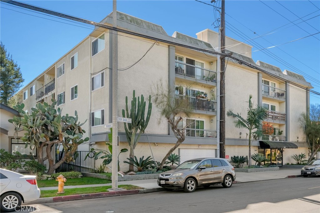 2844 East 3rd Street, Unit 210 Long Beach, CA 90814 - Photo 23 of 23 a car parked in front of a building