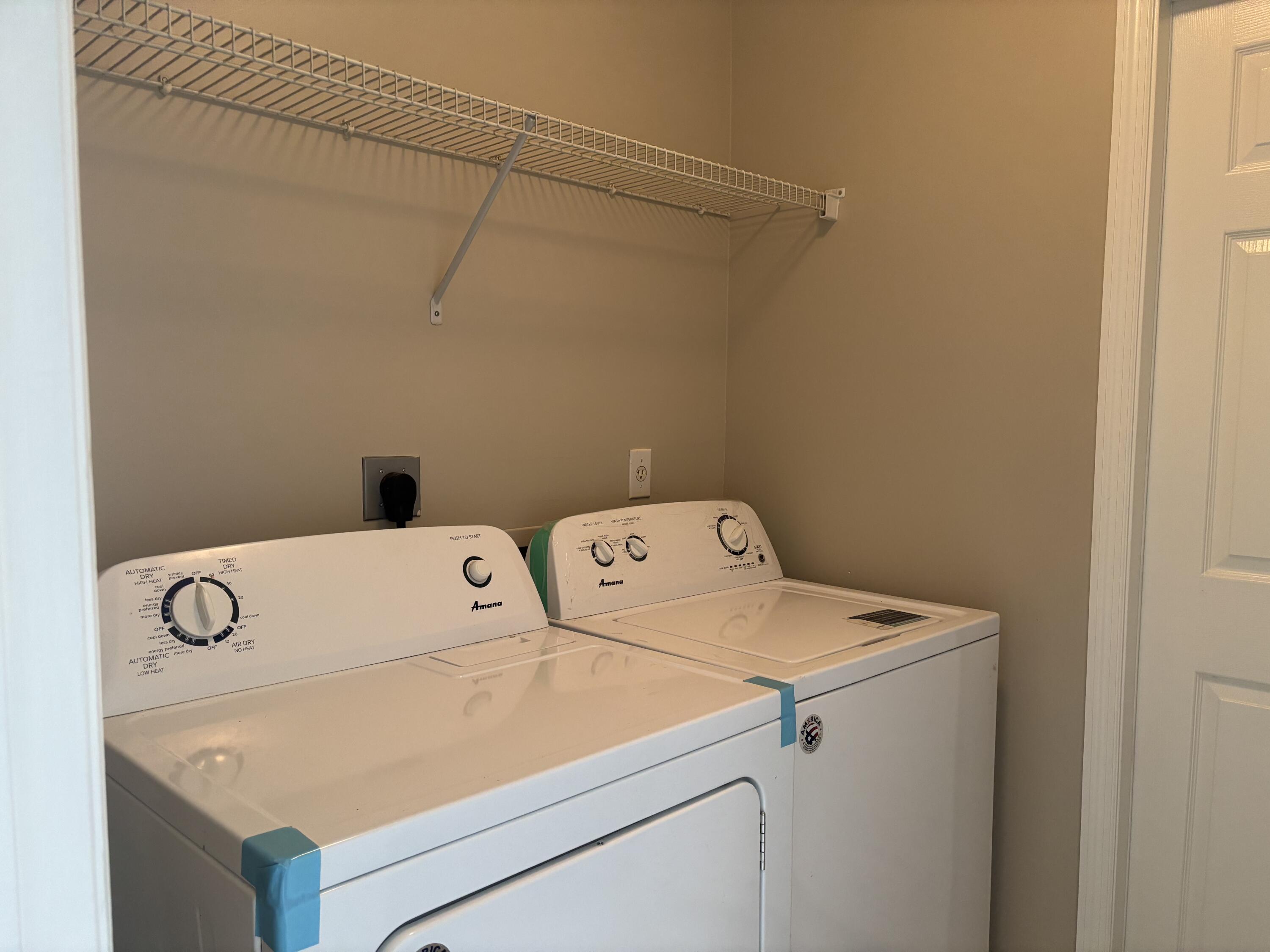 4497 Southwest Gadshaw Road Port St. Lucie, FL 34953 - Photo 13 of 13 a utility room with dryer and washer