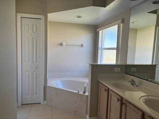 a bathroom with a bathtub and a sink