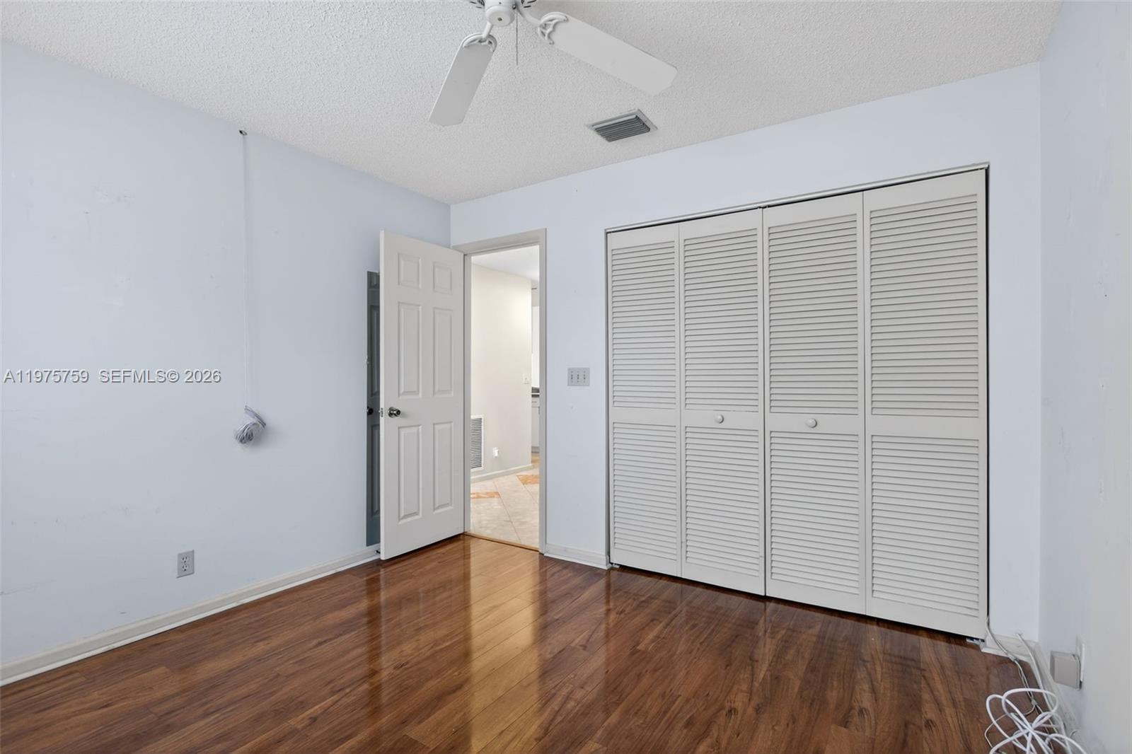 6708 North Pine Island Road Tamarac, FL 33321 - Photo 18 of 40 an empty room with wooden floor