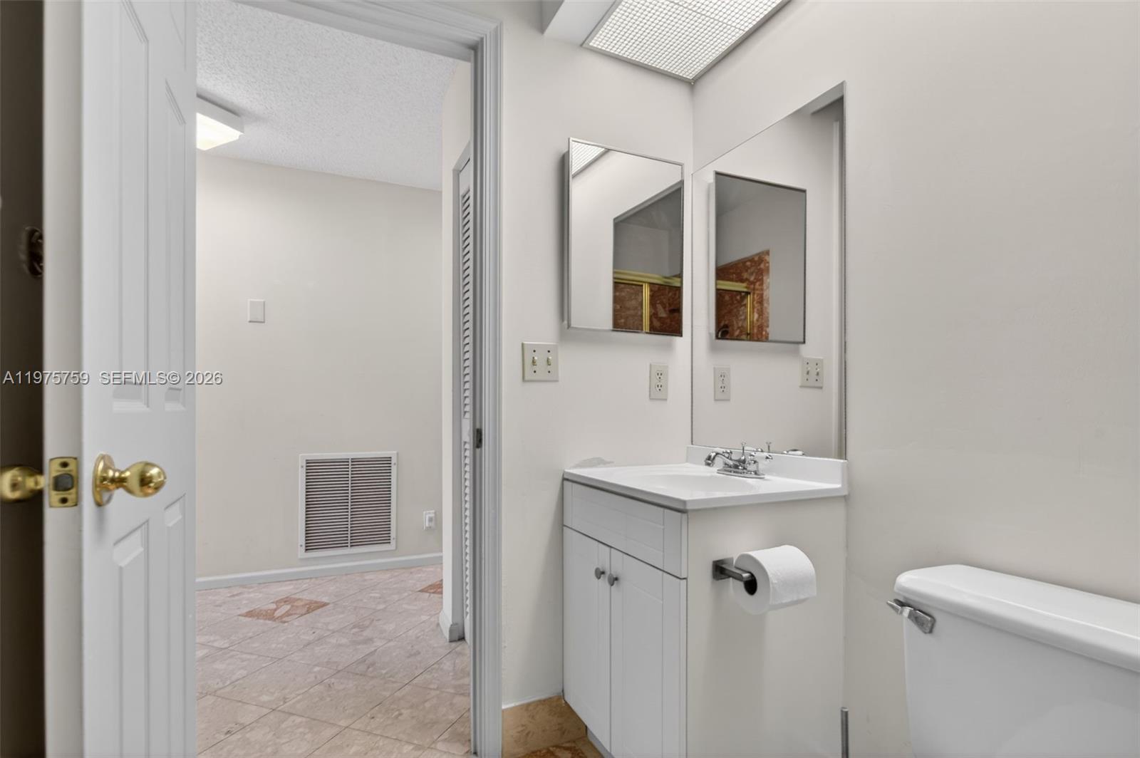 6708 North Pine Island Road Tamarac, FL 33321 - Photo 20 of 40 a bathroom with a sink toilet and shower