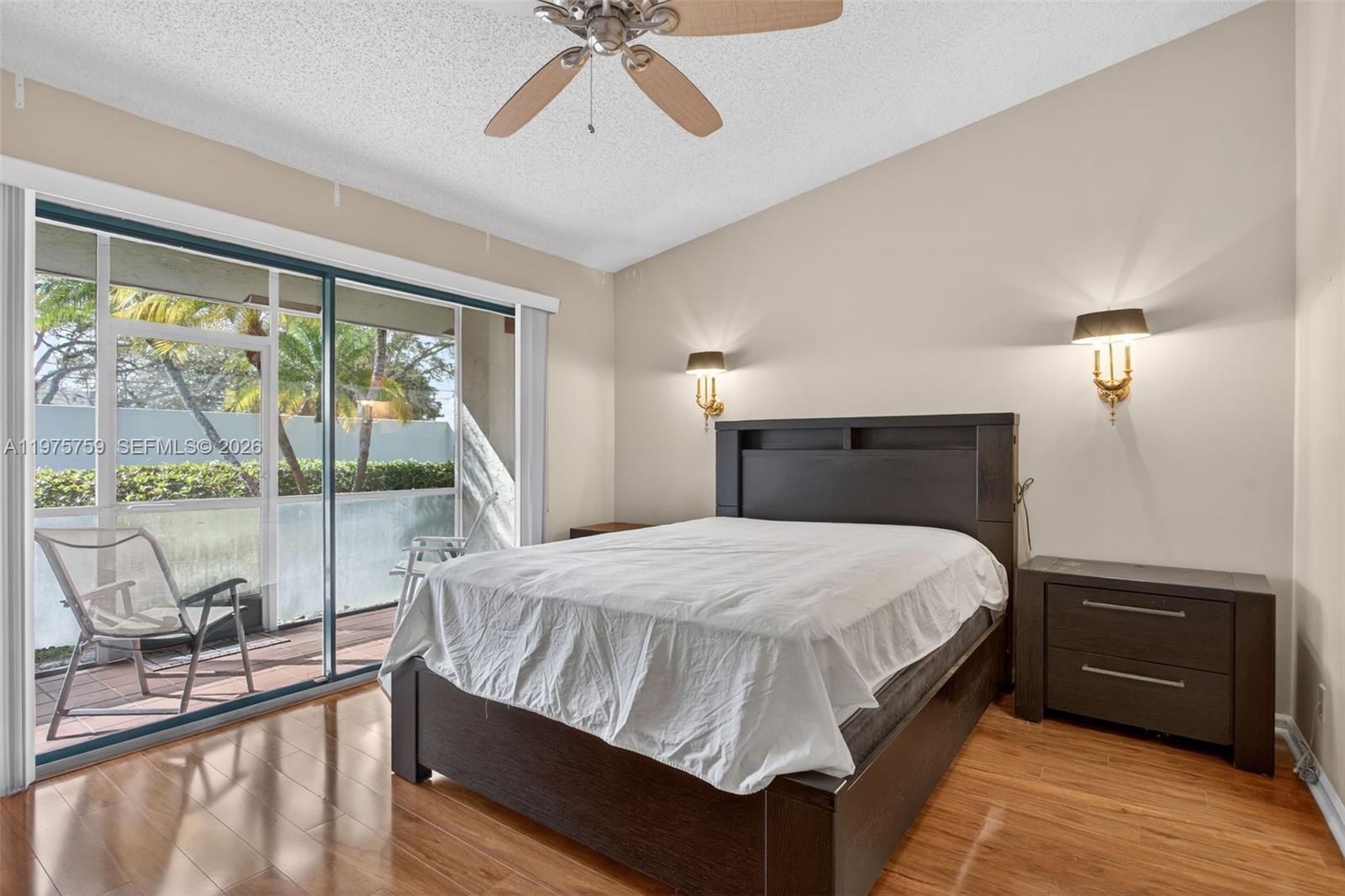 6708 North Pine Island Road Tamarac, FL 33321 - Photo 21 of 40 a bedroom with a bed and a large window