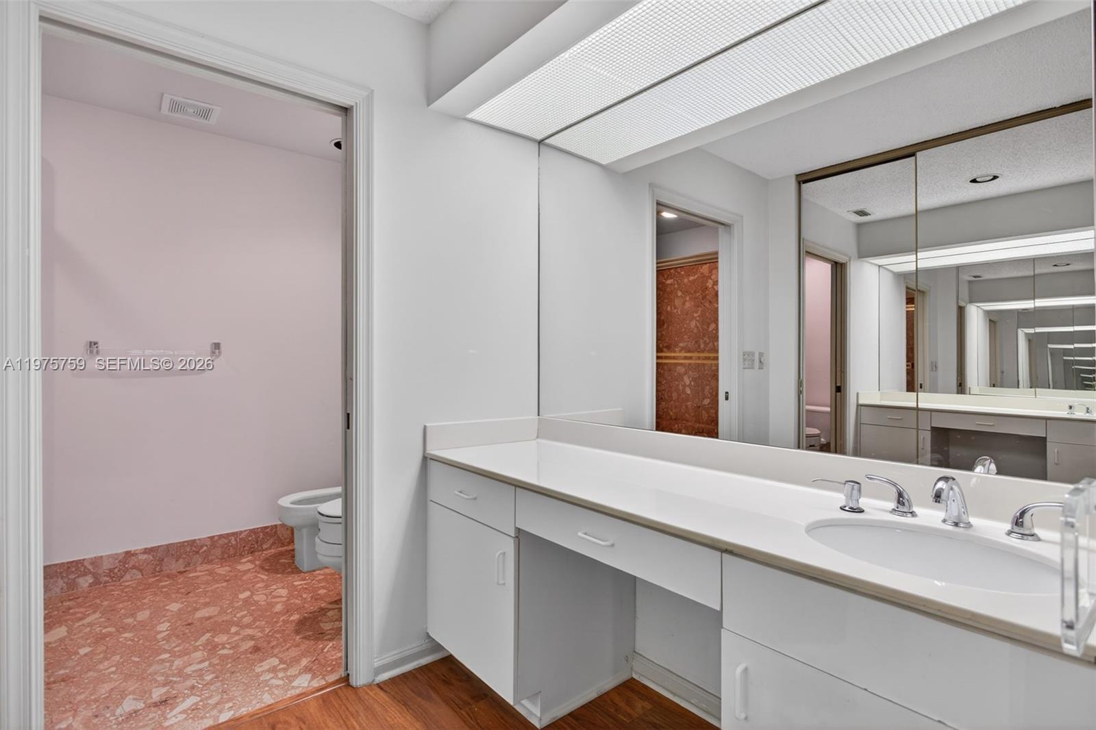 6708 North Pine Island Road Tamarac, FL 33321 - Photo 23 of 40 a bathroom with a sink and a mirror