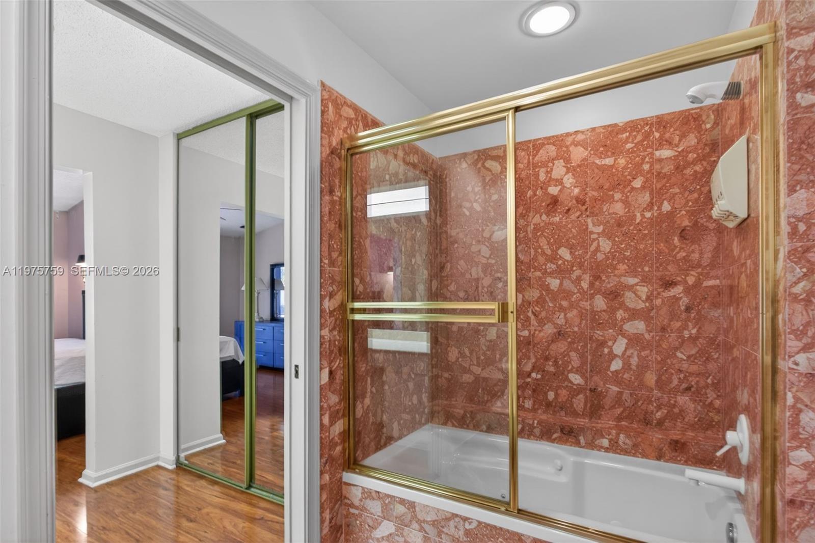 6708 North Pine Island Road Tamarac, FL 33321 - Photo 25 of 40 a bathroom with a glass shower door