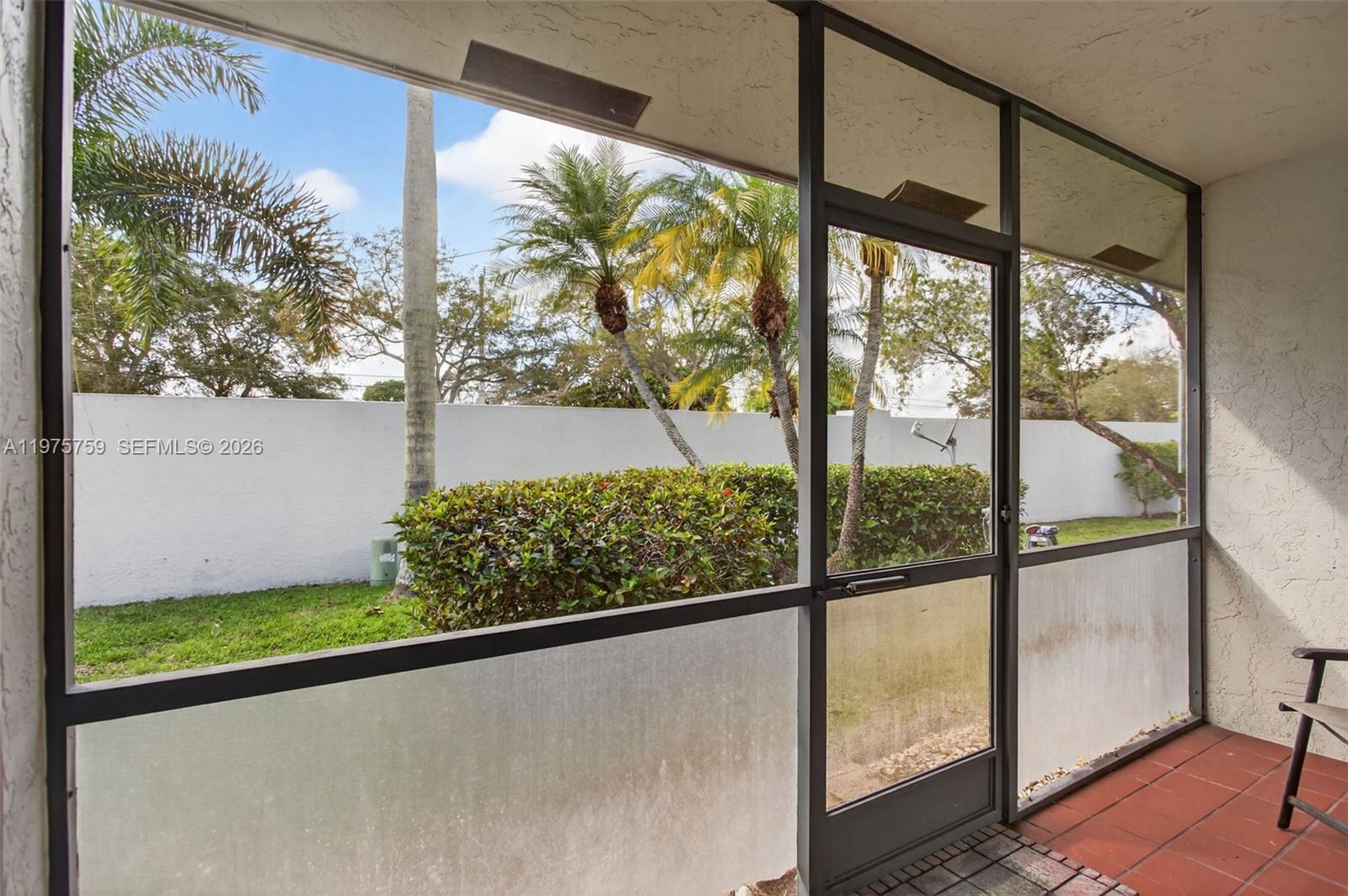 6708 North Pine Island Road Tamarac, FL 33321 - Photo 27 of 40 a view of a porch and a yard