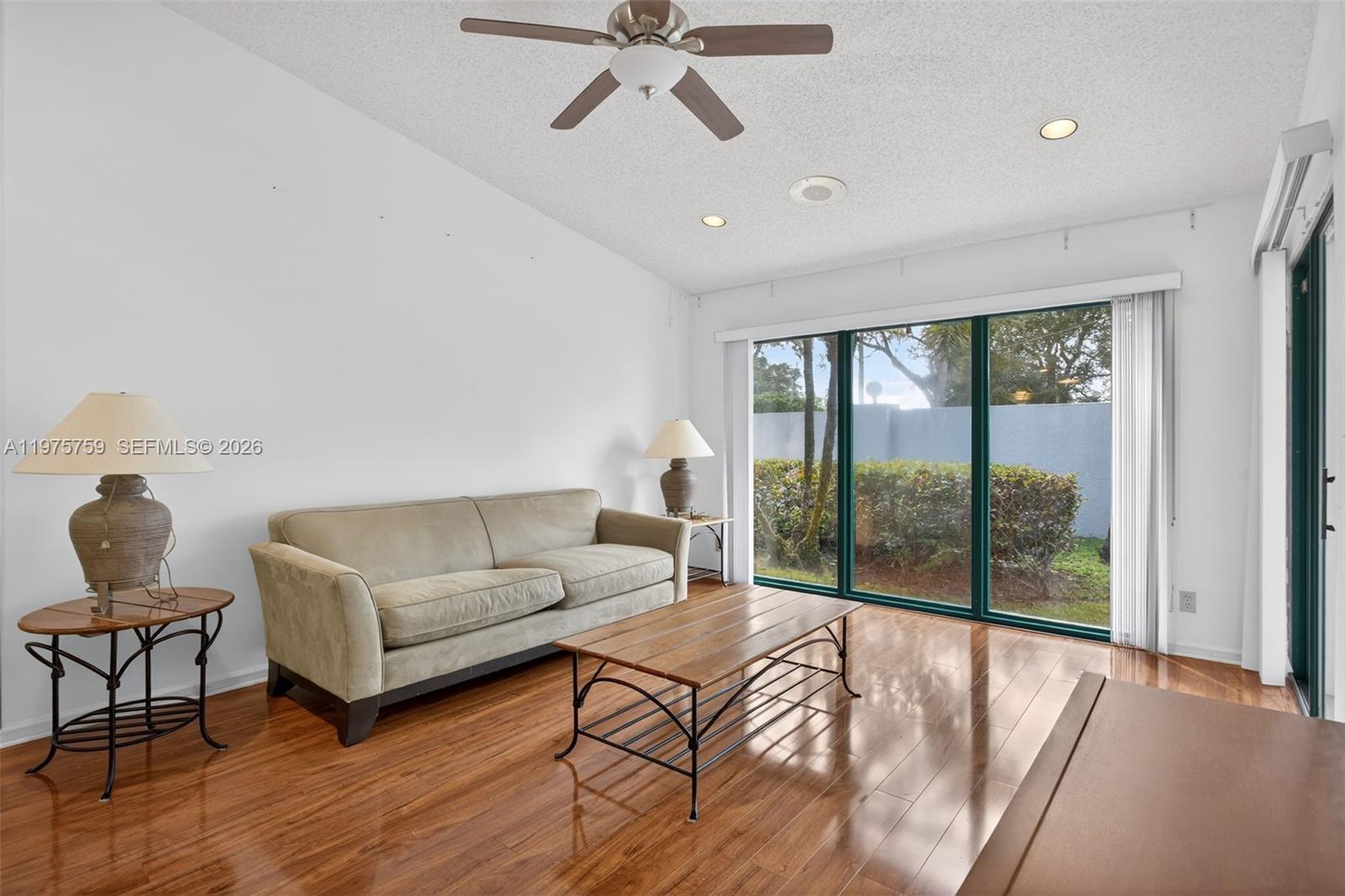 6708 North Pine Island Road Tamarac, FL 33321 - Photo 3 of 40 a living room with furniture and a large window