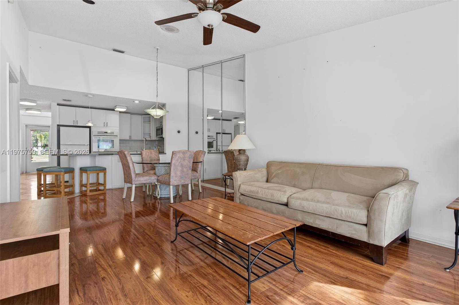 6708 North Pine Island Road Tamarac, FL 33321 - Photo 4 of 40 a living room with furniture and a wooden floor