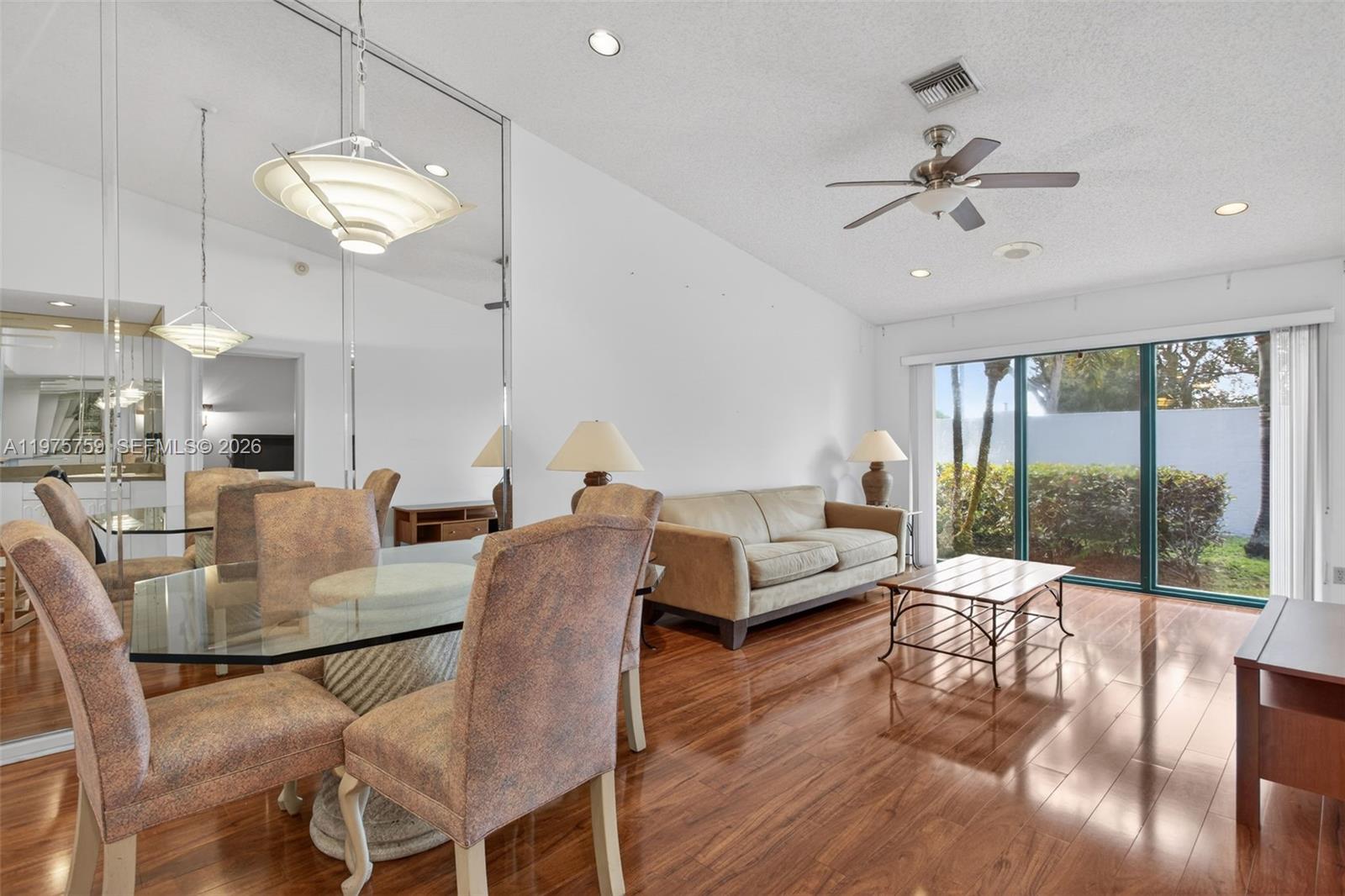 6708 North Pine Island Road Tamarac, FL 33321 - Photo 6 of 40 a living room with fireplace furniture and a large window