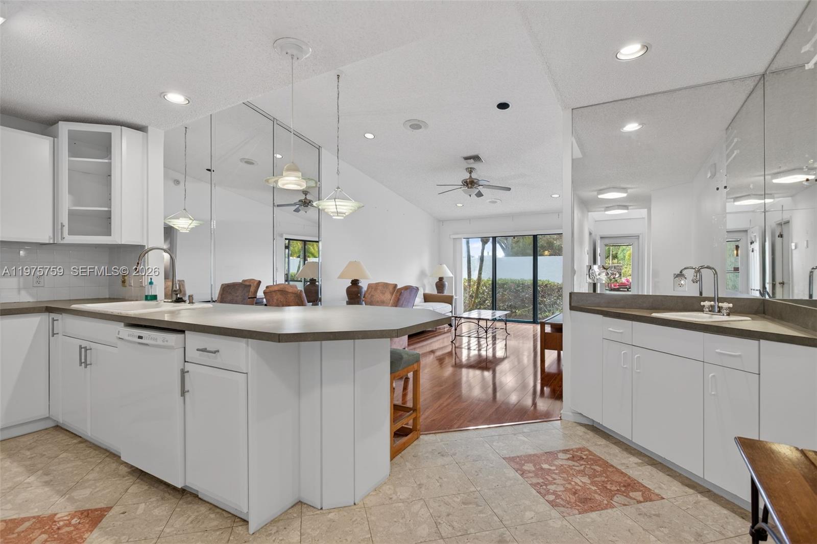 6708 North Pine Island Road Tamarac, FL 33321 - Photo 9 of 40 a large kitchen with lots of counter space and a sink