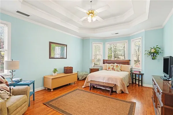 a bedroom with a bed and a couch