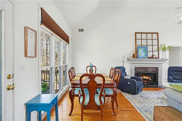 a living room with furniture a fireplace and a window