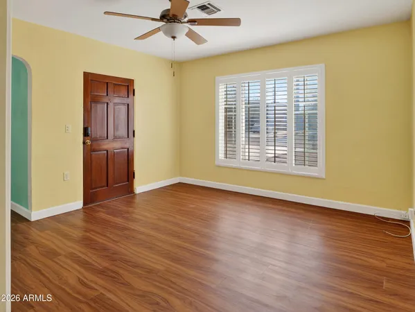 a view of a house with a potted plant windows