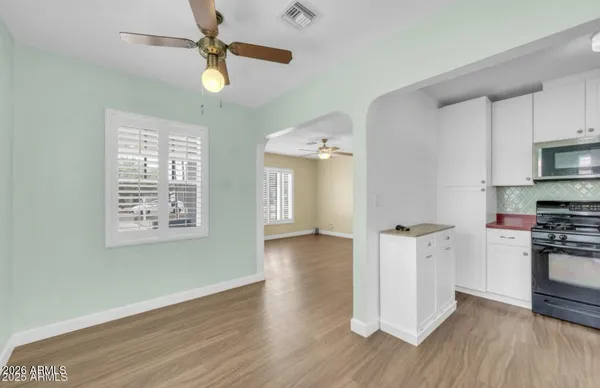 a kitchen with stainless steel appliances granite countertop a stove and a refrigerator