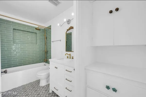 a view of a room with a window and cabinet