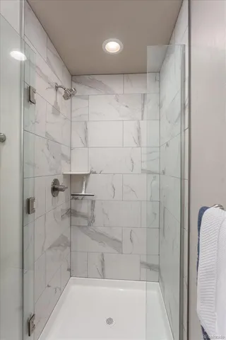 a bathroom with a shower and a bathtub
