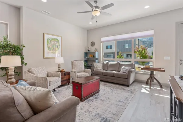 a living room with furniture and a large window