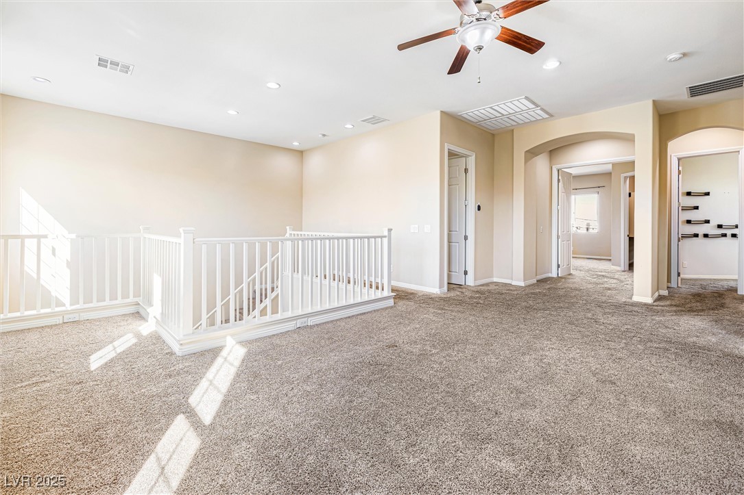 60 Newton Ridge Way Las Vegas, NV 89183 - Photo 26 of 44 Unfurnished room with carpet, recessed lighting, arched walkways, and a ceiling fan