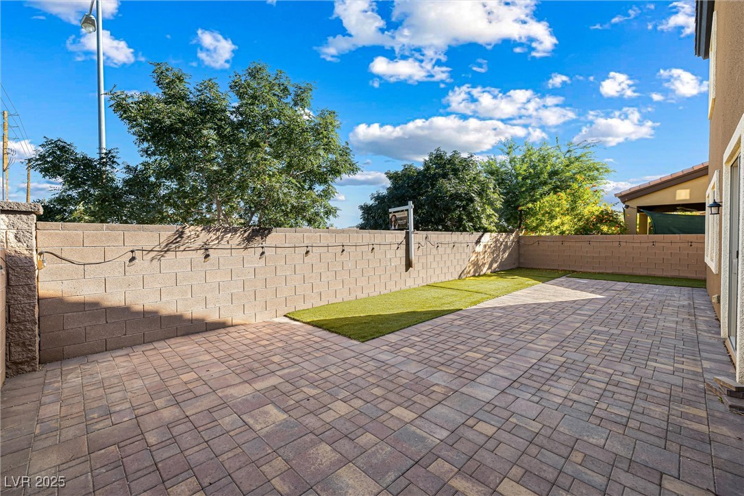 60 Newton Ridge Way Las Vegas, NV 89183 - Photo 37 of 44 Fenced backyard featuring a patio