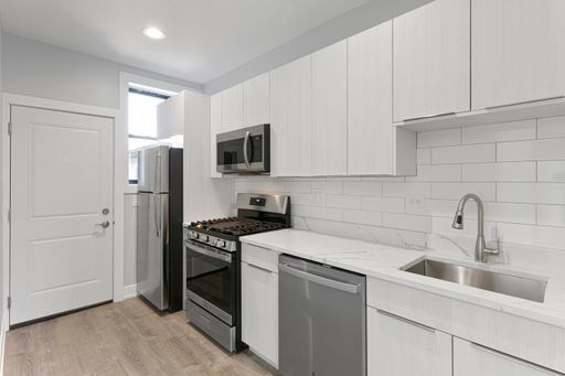 1700 West Juneway Terrace, Unit 3A Chicago, IL 60626 - Photo 6 of 17 a kitchen with a sink appliances and cabinets