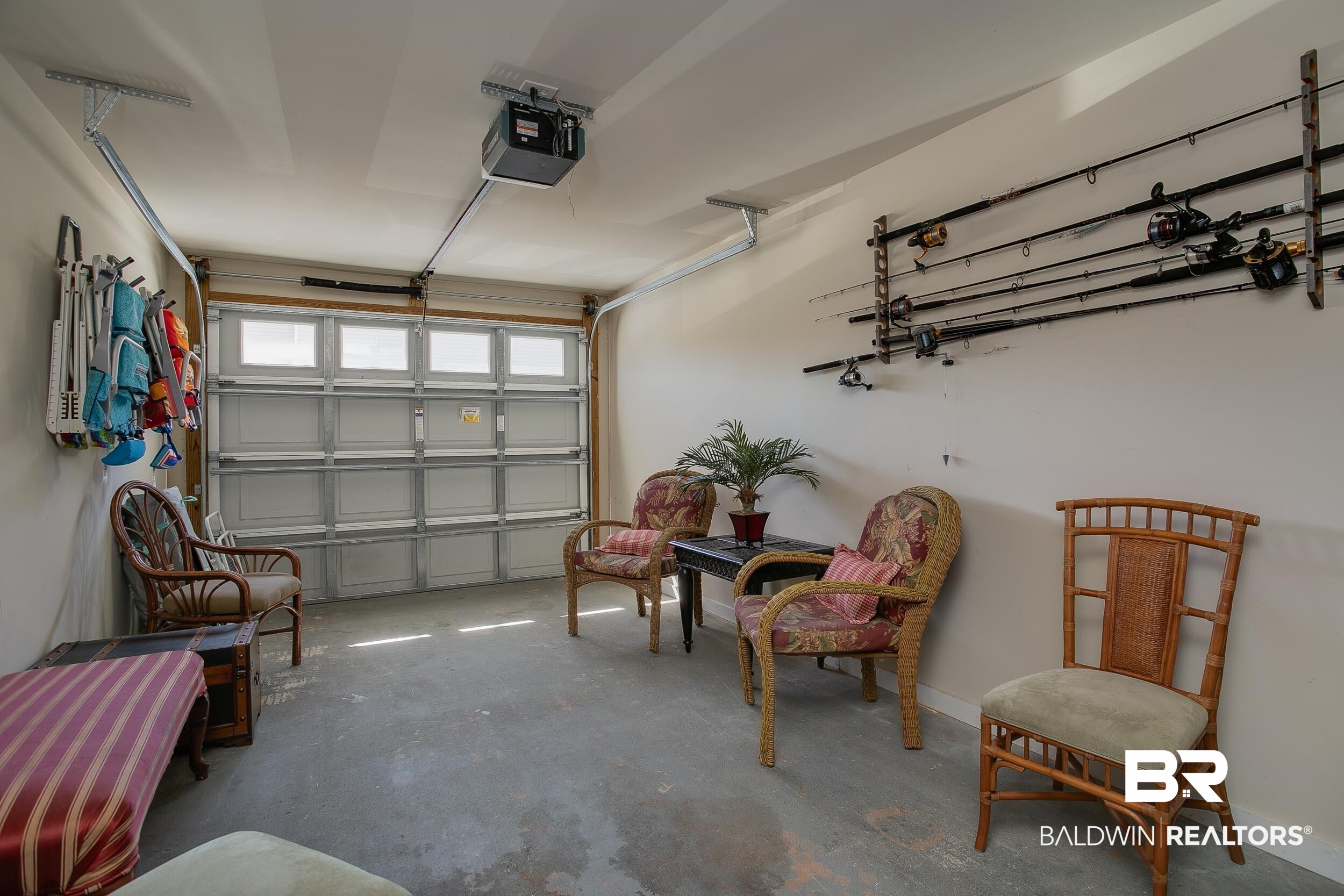 1517 Regency Road, Unit 33 Gulf Shores, AL 36542 - Photo 24 of 29 Garage featuring baseboards and a garage door opener