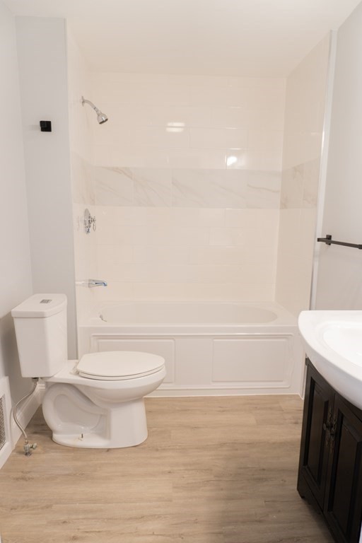 22 Riverside Court Saugus, MA 01906 - Photo 20 of 33 a bathroom with a sink a toilet and shower