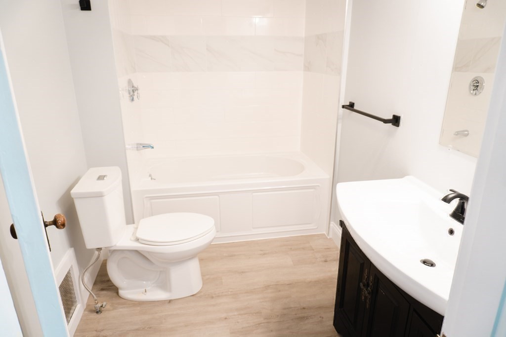 22 Riverside Court Saugus, MA 01906 - Photo 21 of 33 a bathroom with a sink a toilet and shower