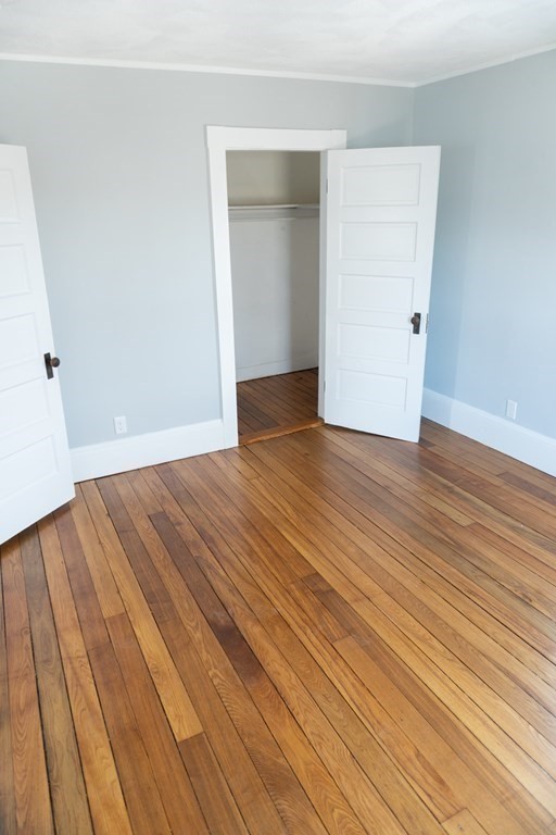 22 Riverside Court Saugus, MA 01906 - Photo 25 of 33 a view of an empty room with wooden floor