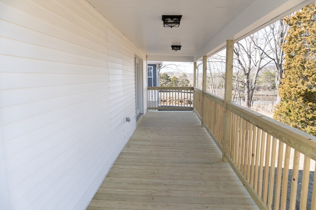 22 Riverside Court Saugus, MA 01906 - Photo 5 of 33 a view of a room with wooden floor and windows