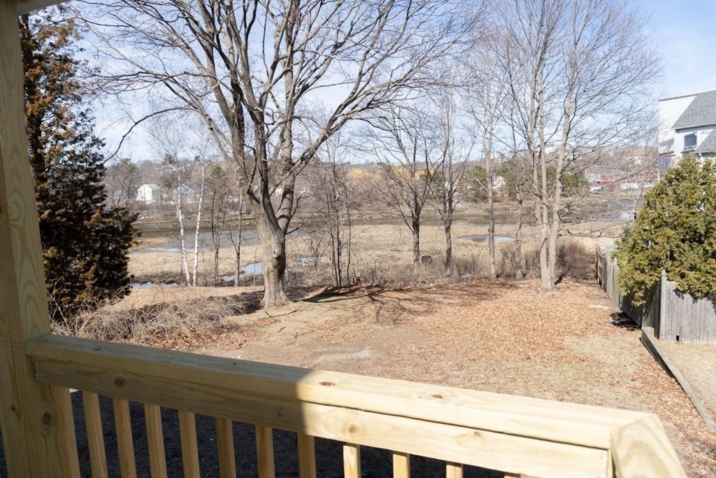 22 Riverside Court Saugus, MA 01906 - Photo 7 of 33 a view of a yard covered with snow in front of house