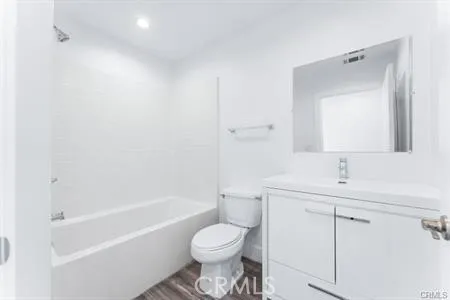 a bathroom with a sink toilet and bathtub