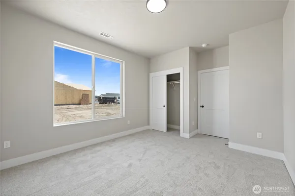 an empty room with a empty space and window