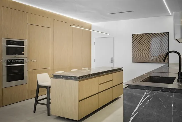 a living room with furniture wooden floor and a flat screen tv