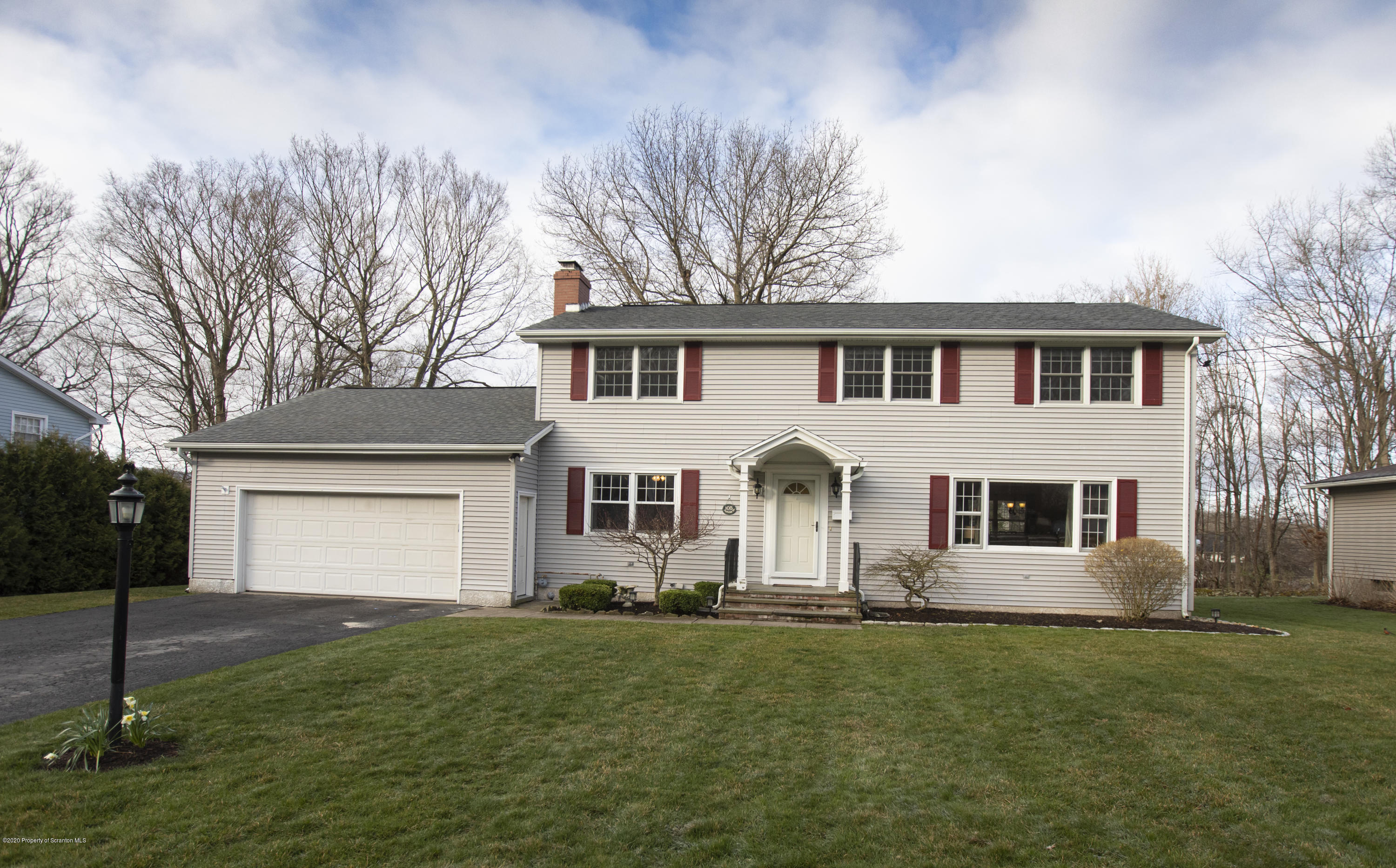 105 Sturbridge Road Clarks Summit, PA 18411 - Photo 1 of 56 a front view of a house with a garden
