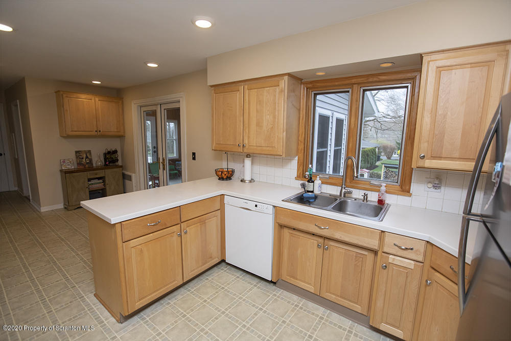 105 Sturbridge Road Clarks Summit, PA 18411 - Photo 15 of 56 a kitchen that has a sink and a stove in it