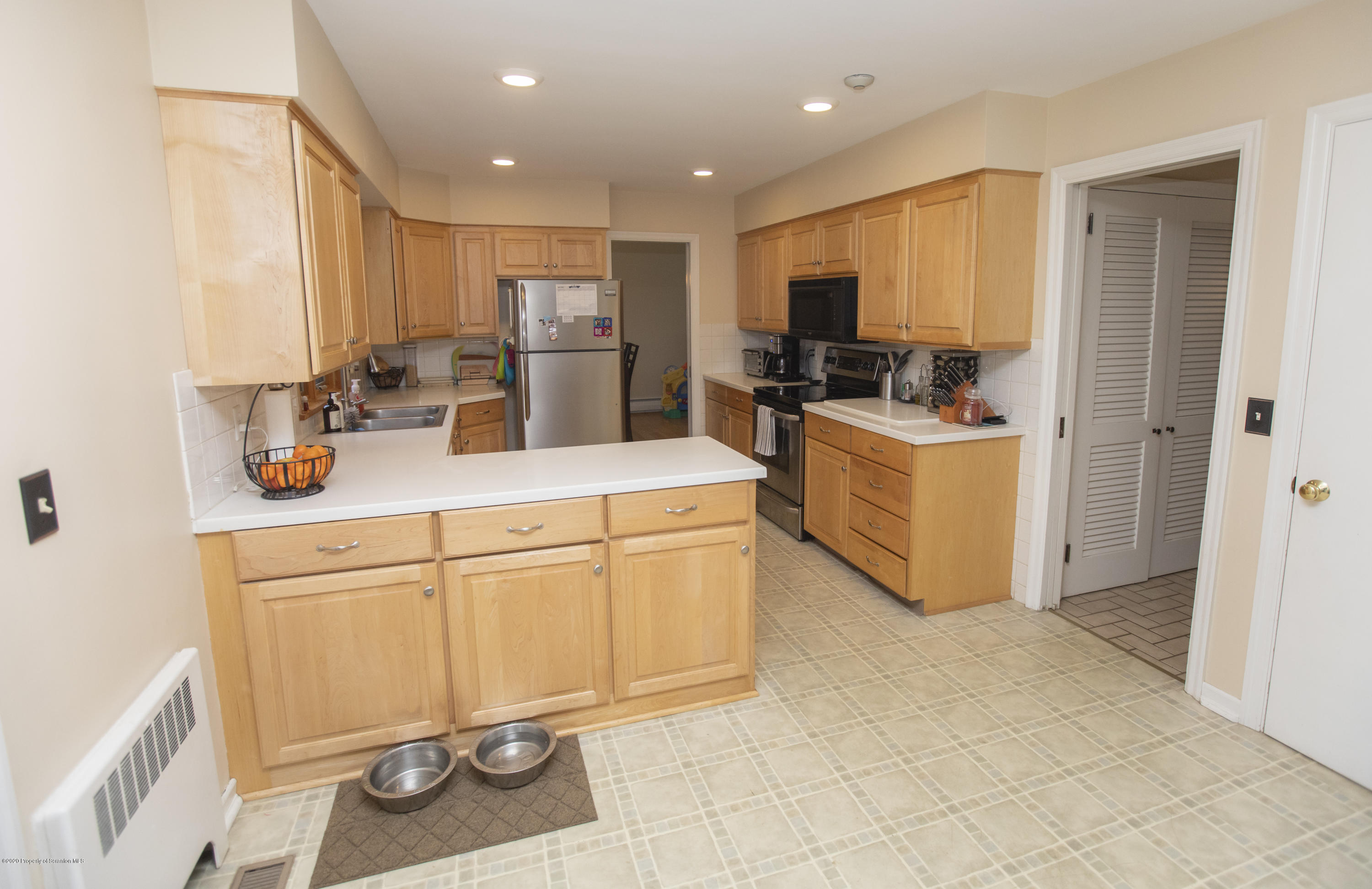 105 Sturbridge Road Clarks Summit, PA 18411 - Photo 17 of 56 a kitchen with stainless steel appliances granite countertop a refrigerator and a stove top oven