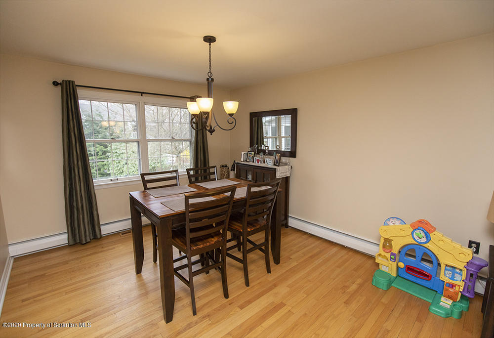 105 Sturbridge Road Clarks Summit, PA 18411 - Photo 18 of 56 a view of a dining room with furniture window and wooden floor