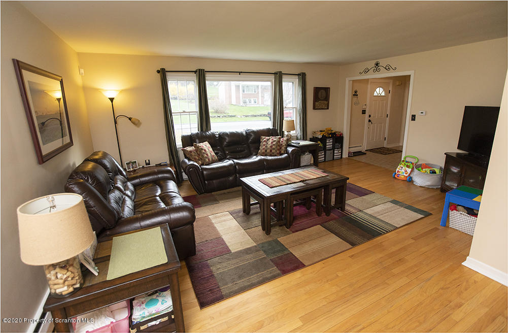 105 Sturbridge Road Clarks Summit, PA 18411 - Photo 20 of 56 a living room with furniture and a flat screen tv