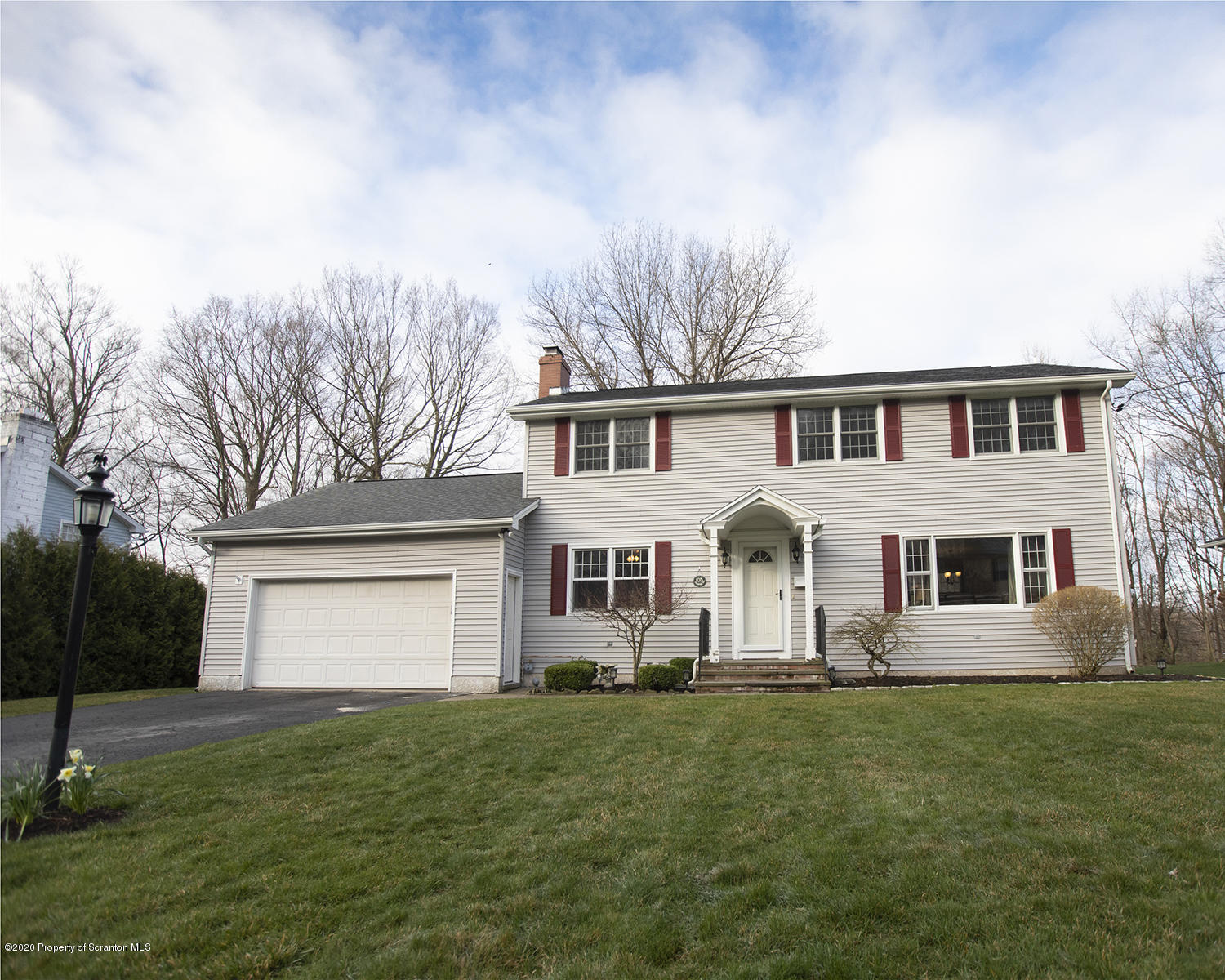 105 Sturbridge Road Clarks Summit, PA 18411 - Photo 2 of 56 a front view of house with yard and green space