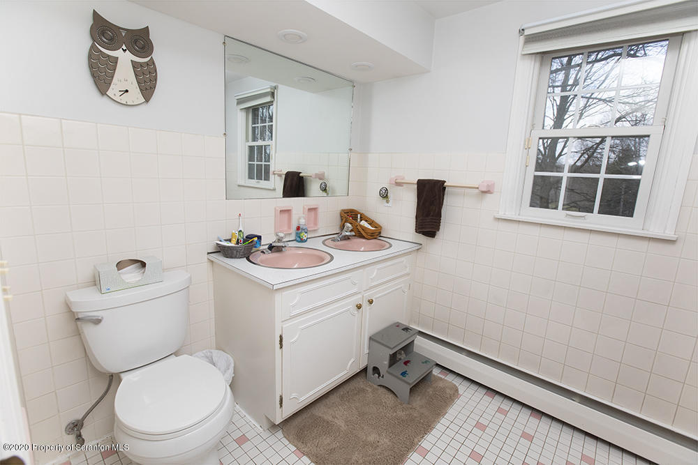 105 Sturbridge Road Clarks Summit, PA 18411 - Photo 21 of 56 a bathroom with a toilet a sink and a window