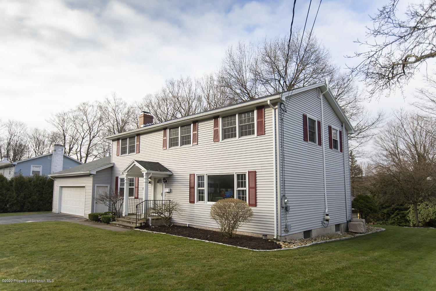 105 Sturbridge Road Clarks Summit, PA 18411 - Photo 3 of 56 a view of a white house with a big yard and potted plants