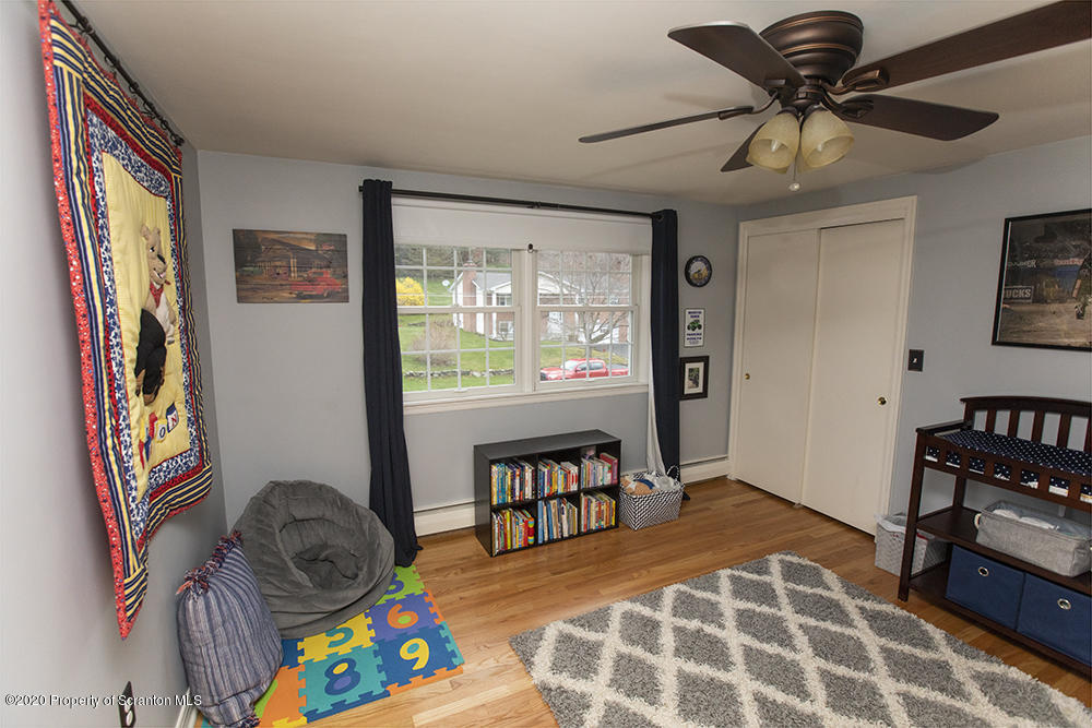 105 Sturbridge Road Clarks Summit, PA 18411 - Photo 32 of 56 a living room with furniture and a flat screen tv