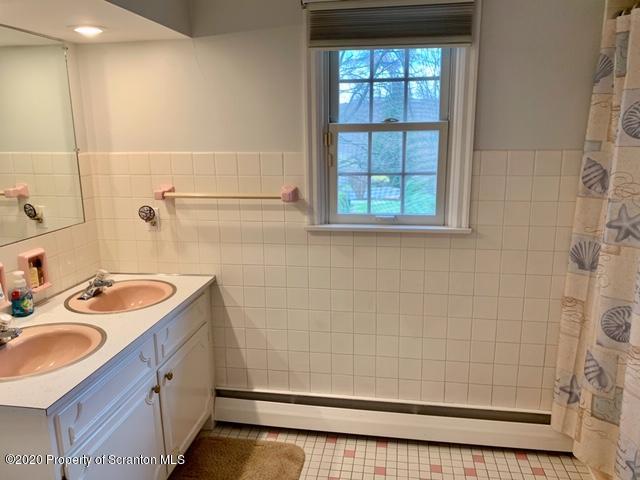 105 Sturbridge Road Clarks Summit, PA 18411 - Photo 37 of 56 a bathroom with a sink a vanity and a shower