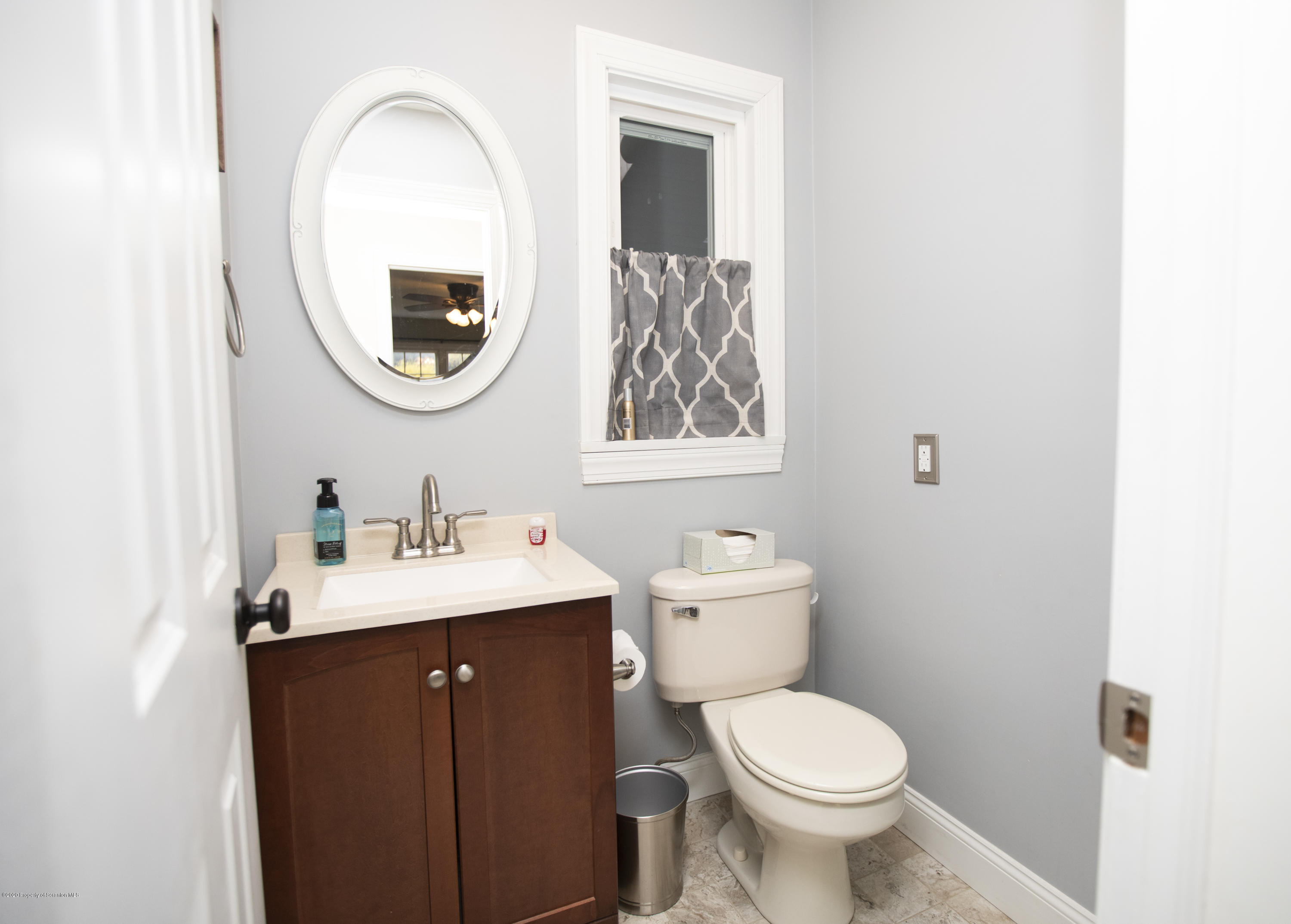 105 Sturbridge Road Clarks Summit, PA 18411 - Photo 39 of 56 a bathroom with a toilet a sink and a mirror