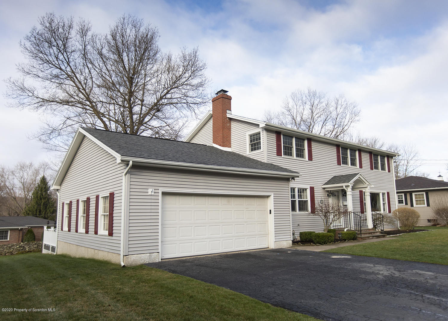 105 Sturbridge Road Clarks Summit, PA 18411 - Photo 4 of 56 a front view of a house with a yard and garage